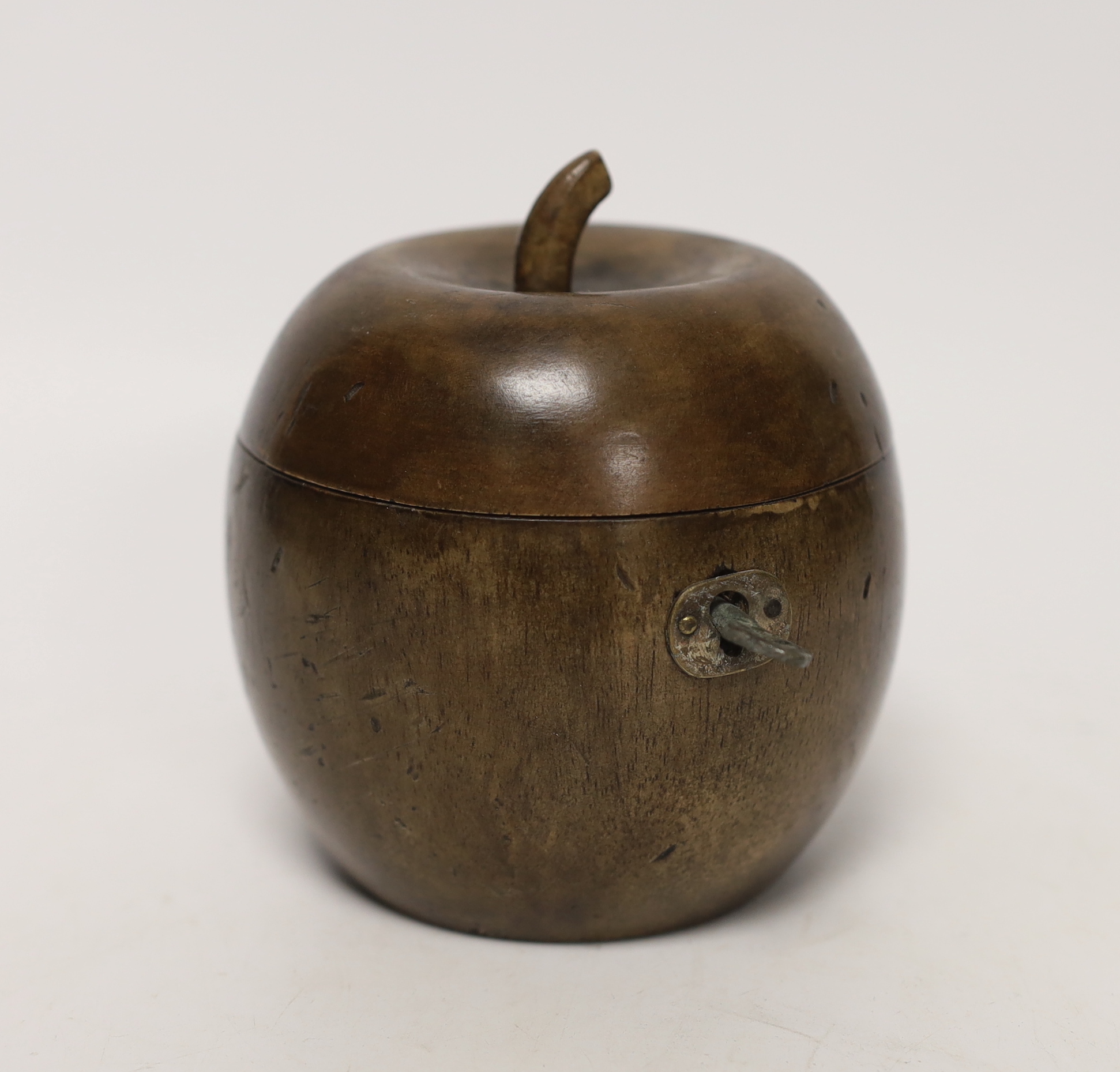 A treen apple shaped tea caddy, in George III style, 10cm high